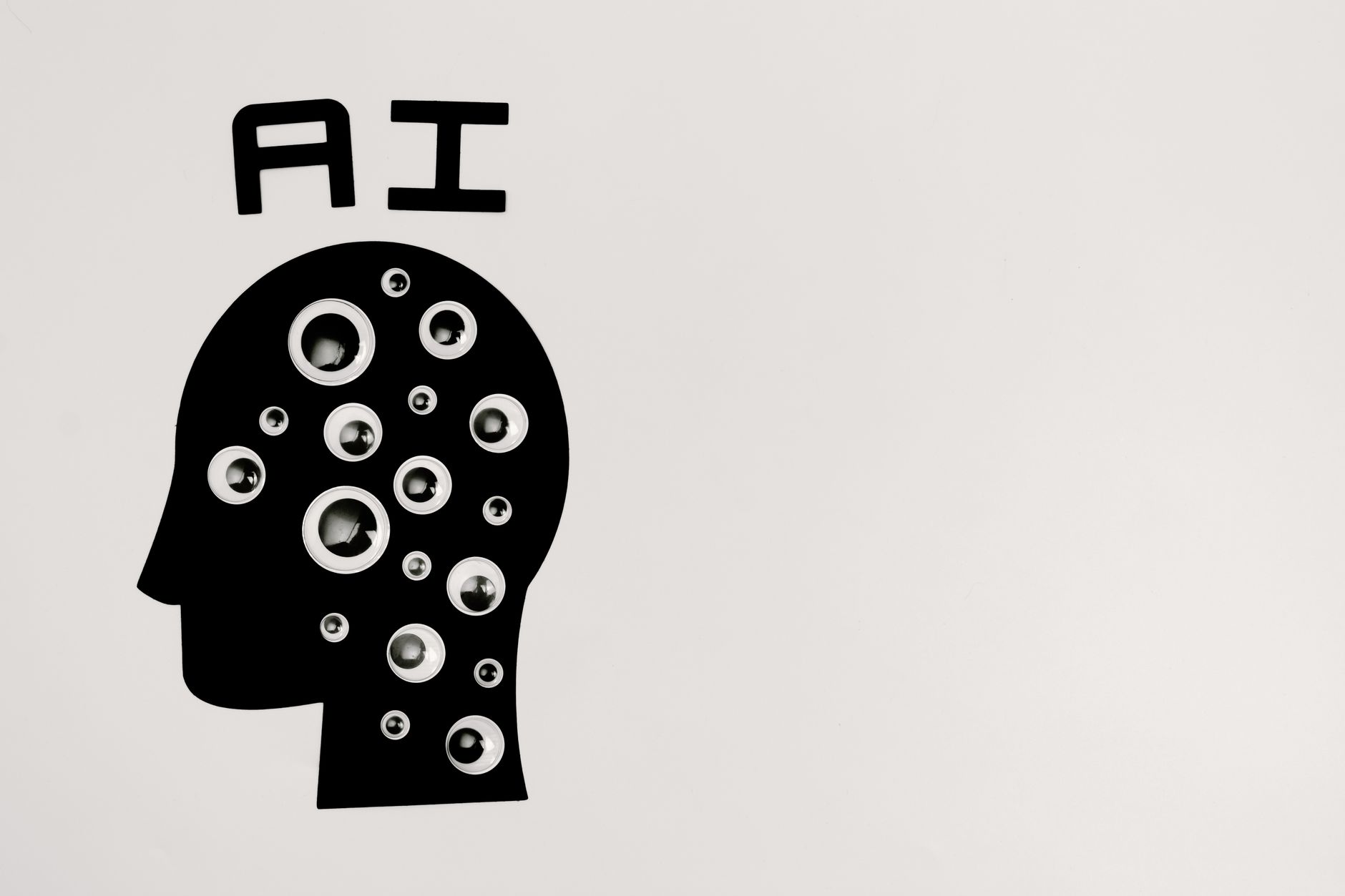 Abstract illustration of AI with silhouette head full of eyes